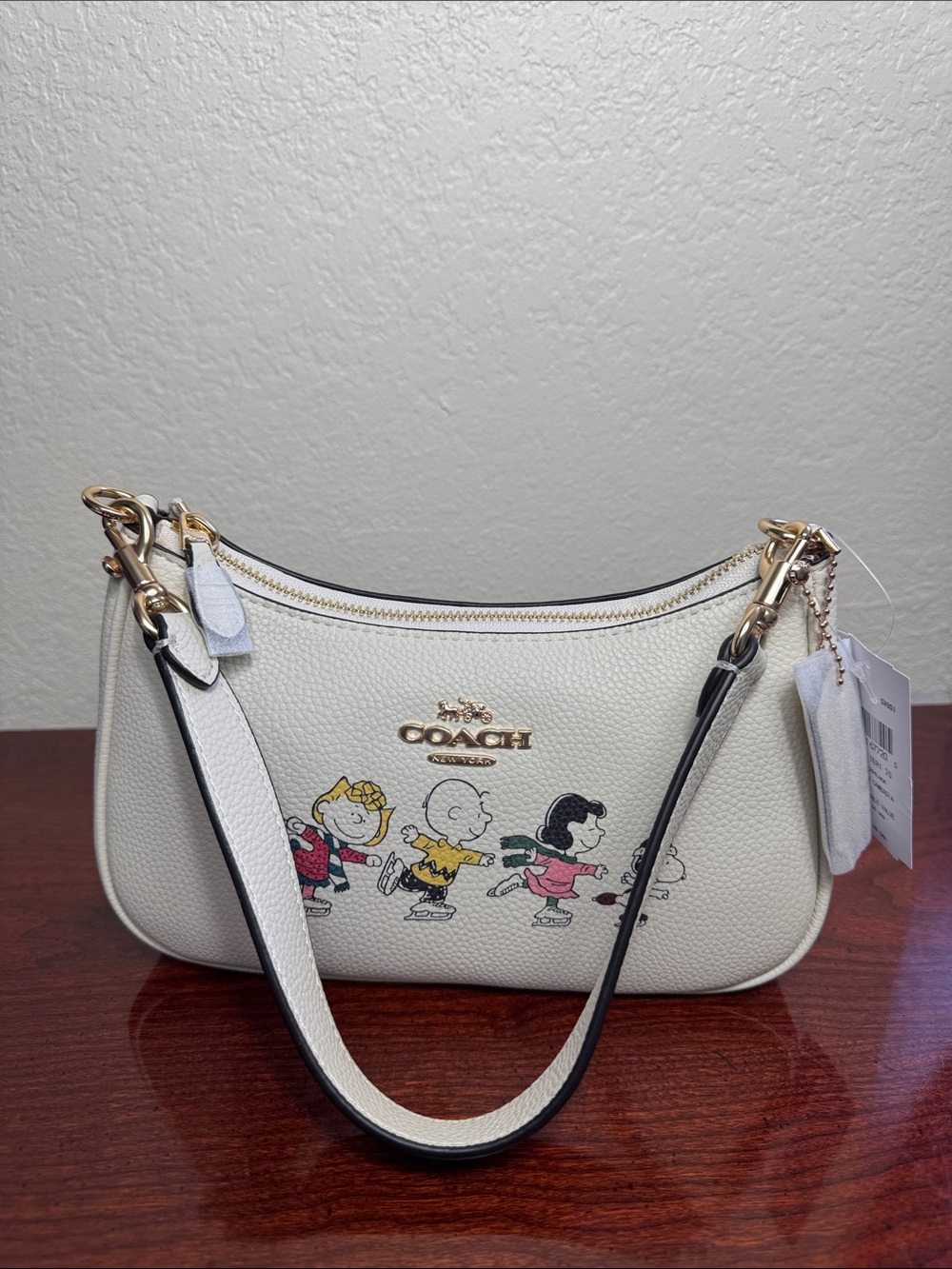 Coach X Peanuts Teri With Snoopy And Friends Motifs Cream Mini Bag.